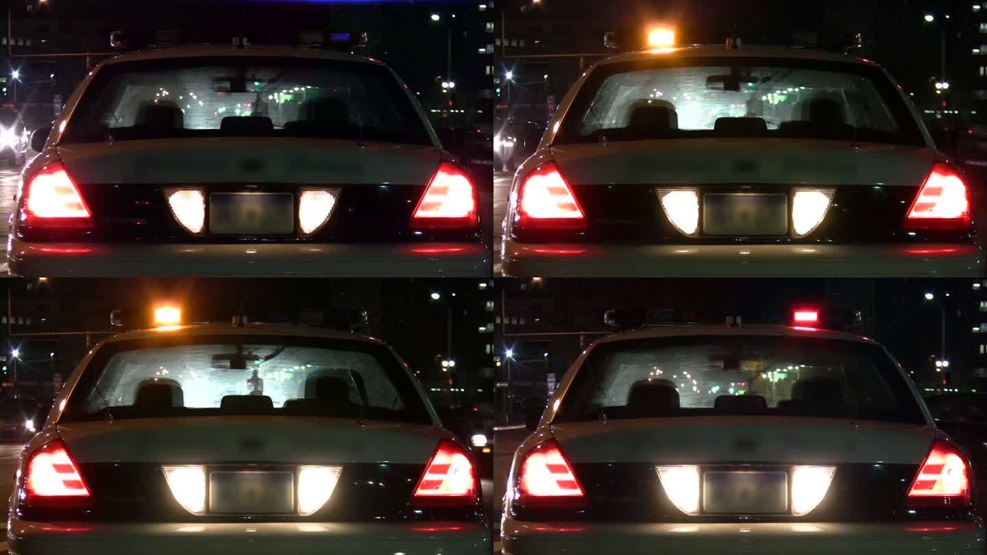 警车车灯夜间闪烁。