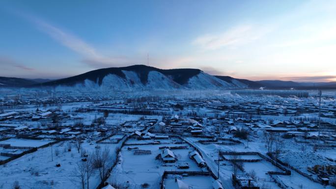 航拍寒冬黎明森林小镇雪景