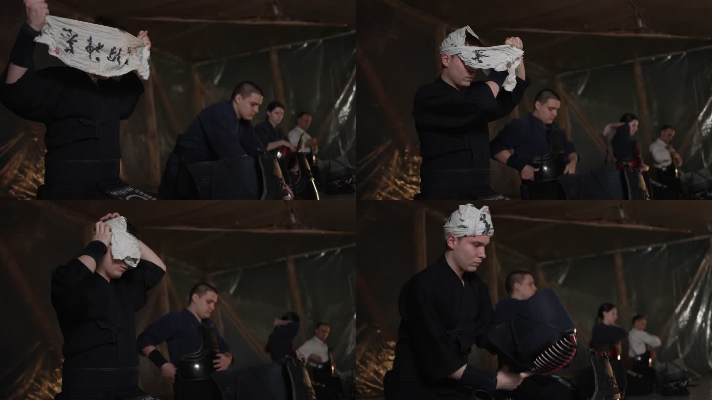 在剑道训练之前，专注的学生，在头上戴上伤疤，这样当他戴上头盔时会感觉很舒服