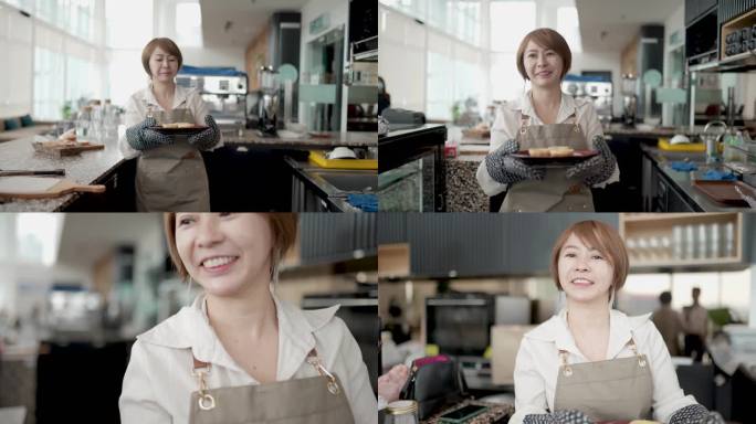 亚洲华人企业主面带微笑，围裙上拿着一盘糕点送给顾客