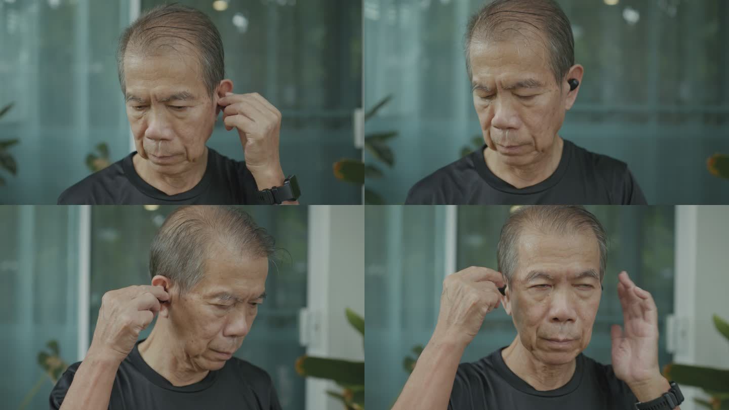 一位戴着蓝牙耳机的亚洲老人。