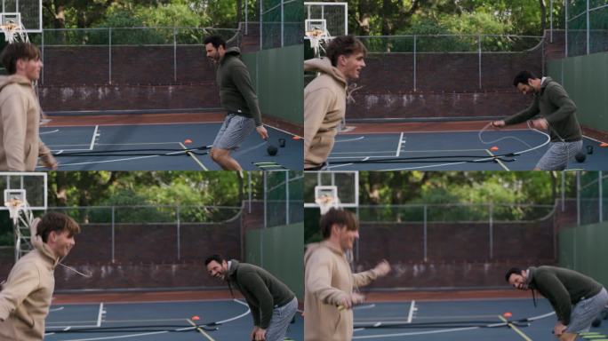 父亲和儿子在篮球比赛中使用跳绳。年轻人和十几岁的男孩用跳绳热身