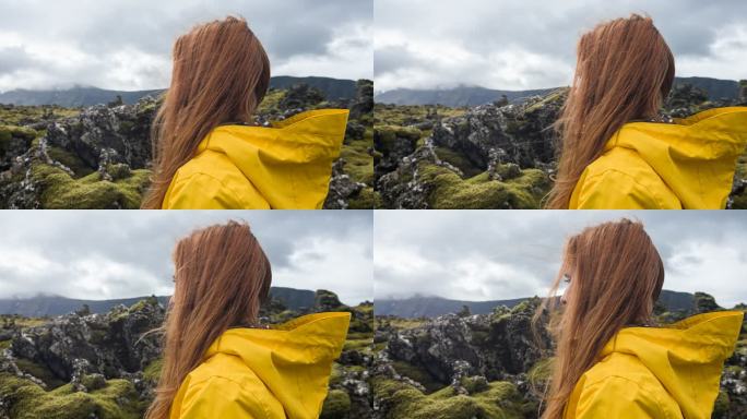 探索冰岛，欣赏青苔景观的女游客