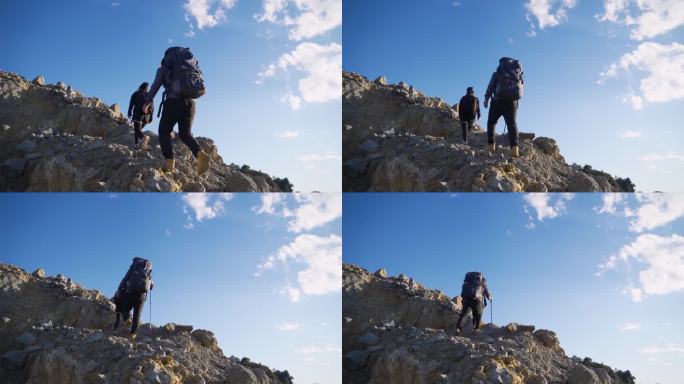 年轻夫妻登山团队登山背影攀登顶峰户外探险