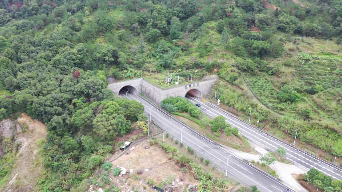 航拍高速公路隧道汽车行驶出来行驶进去隧道