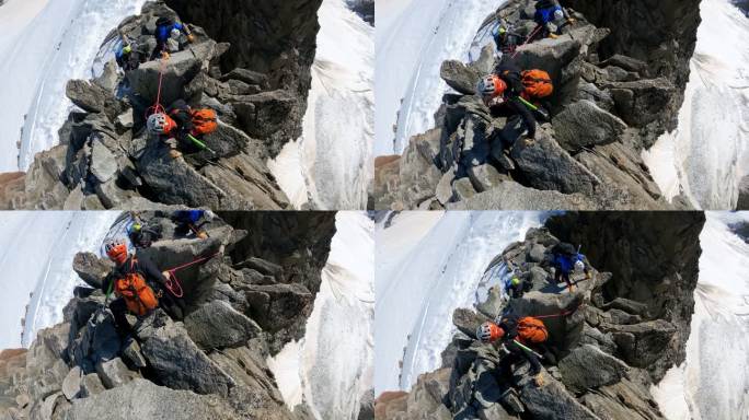 攀登欧洲阿尔卑斯山陡峭山峰的专业资深登山者。使用绳索。鸟瞰图