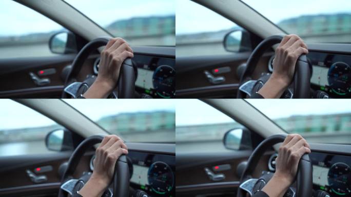 开车驾驶员手握方向盘特写仪表盘汽车行驶