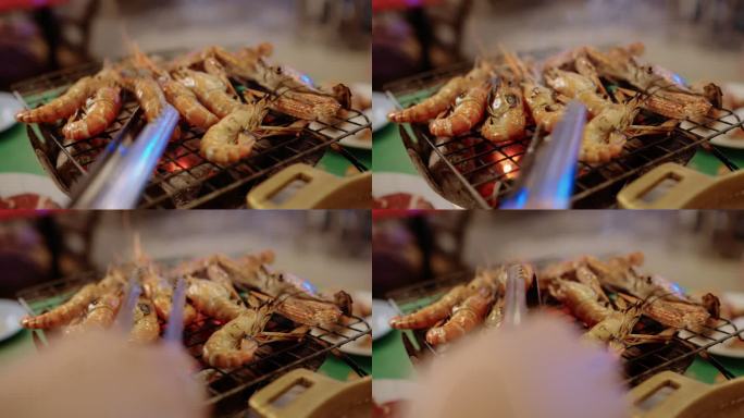 炉灶上的褶皱虾烧烤木炭炉烤龙虾大虾