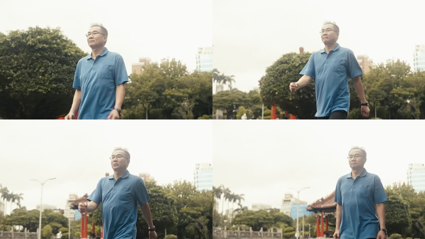 活跃的亚洲男性在公园散步（慢动作）