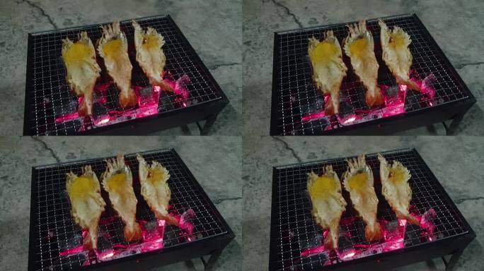 木炭炉上的烤虾。实拍视频素材