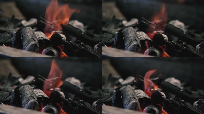 燃烧煤炭。烧烤架上燃烧煤炭的特写视频。木炭燃烧。