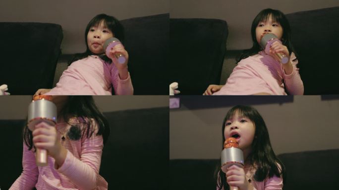 小可爱的女孩在她父亲的旁边唱歌，听客厅里的股票视频
