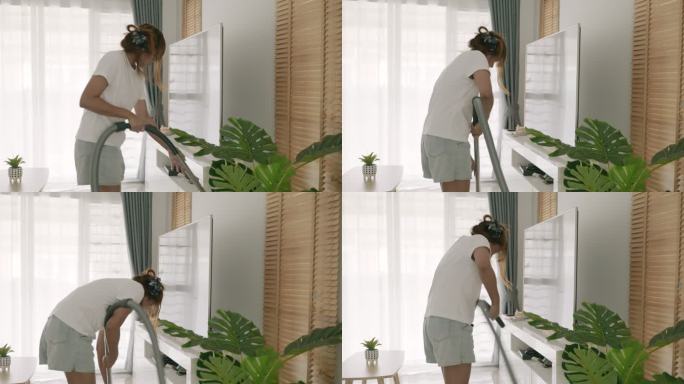 亚洲女人打扫新买的房子的场景。