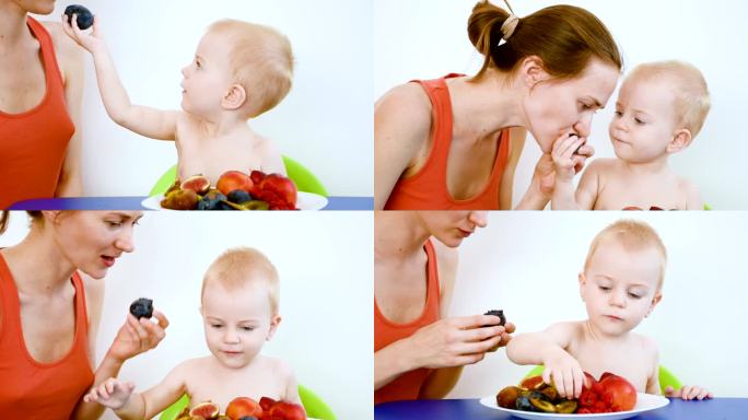 小男孩和他的妈妈在吃水果