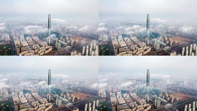 航拍云雾中的天津滨海新区周大福金融中心