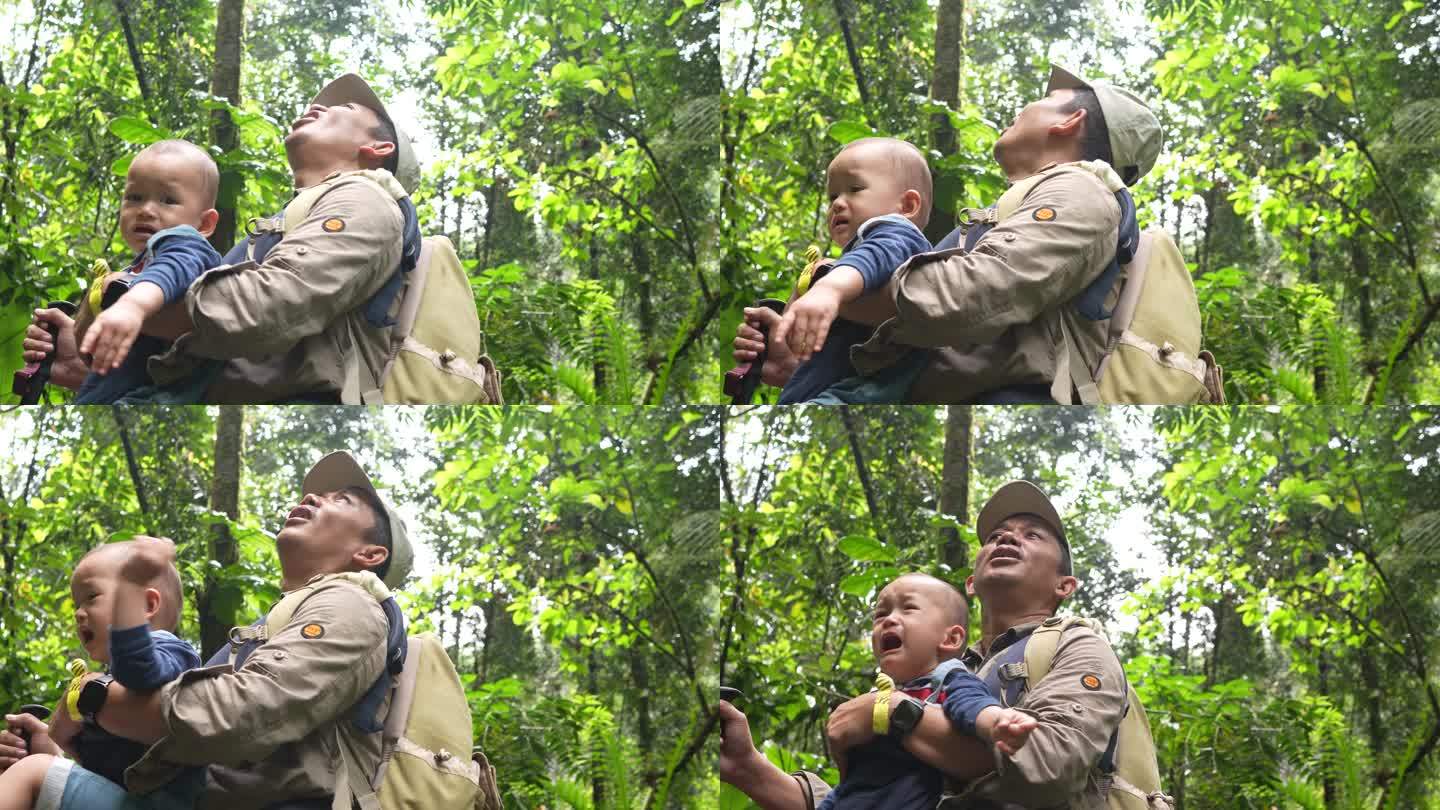 亚洲父母带着孩子在森林里哭泣