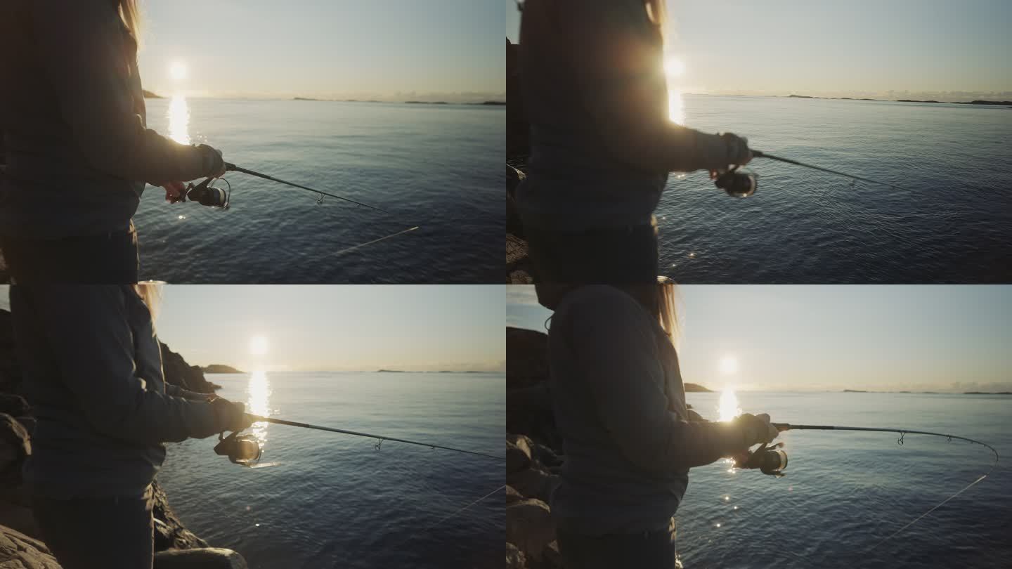 挪威户外：一名妇女用鱼竿在海里钓鱼