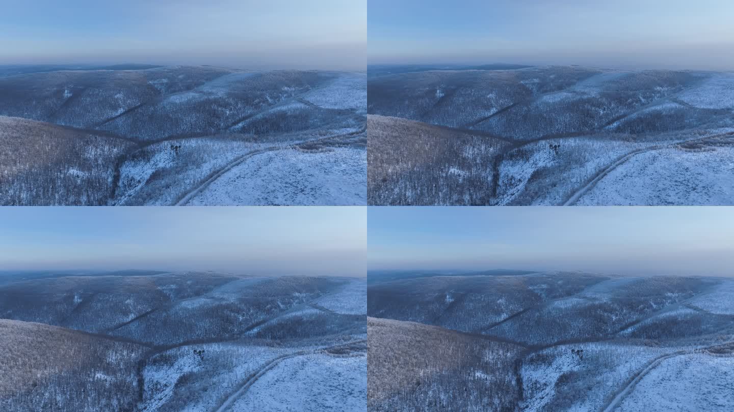 航拍逶迤山岭雪林雾凇