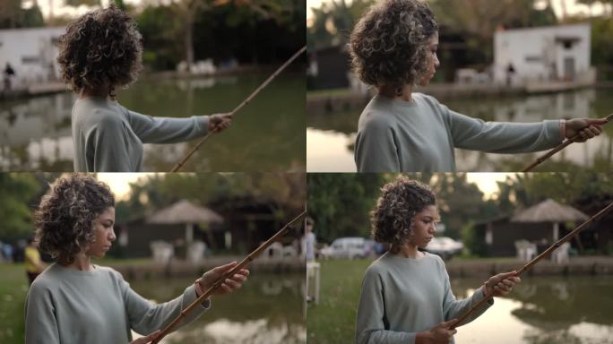 钓到一条鱼国外黑人女孩竹竿钓鱼