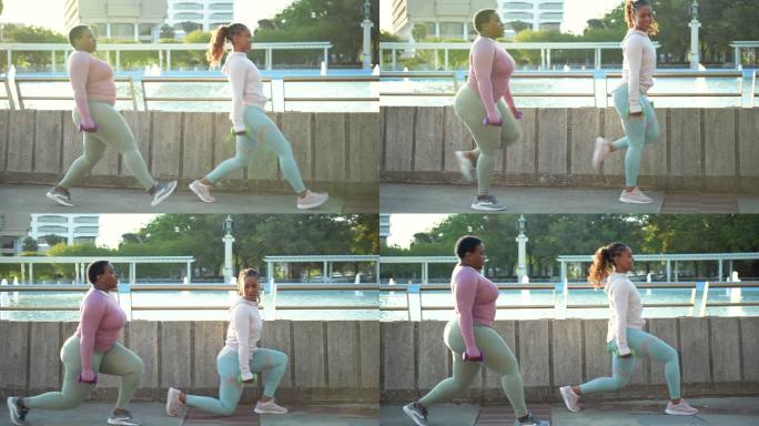 两名非裔美国妇女在城市公园做弓箭步