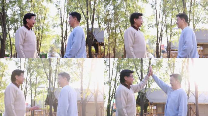 两个中老年男人开心地击掌