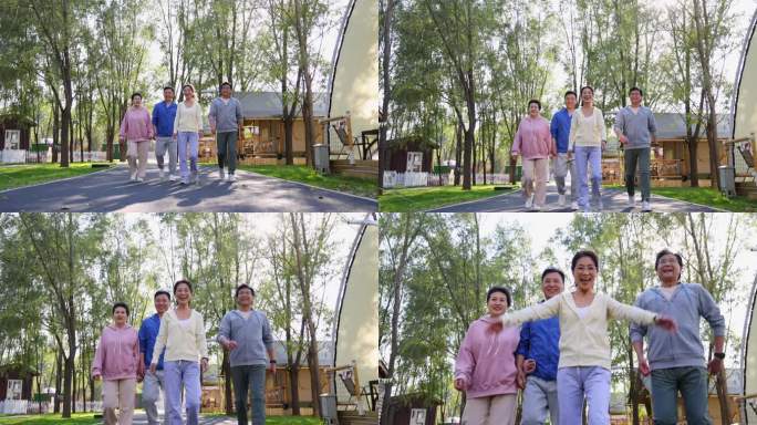 一群穿运动服的中老年人清晨散步握拳欢呼