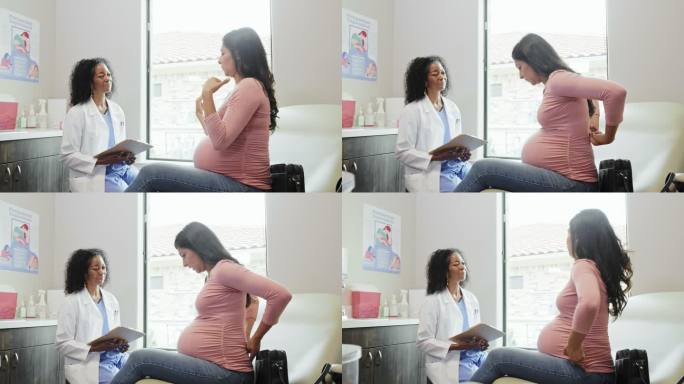 孕妇与医生讨论怀孕不适