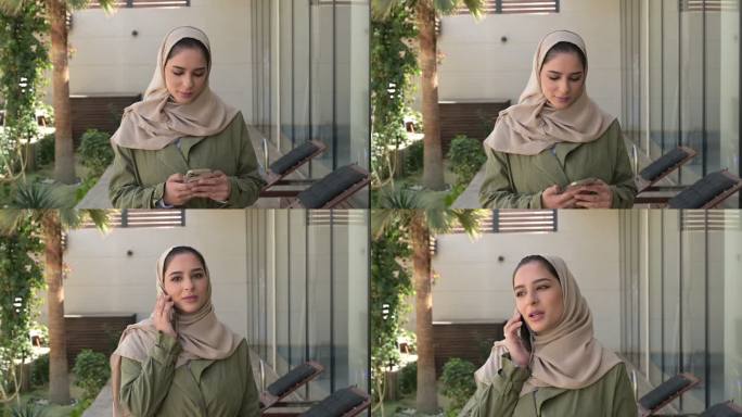 年轻的中东妇女在户外使用电话