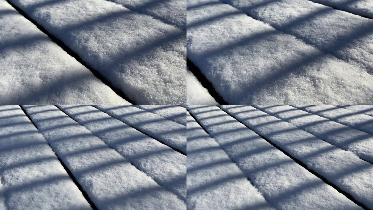冬天下雪天 积雪  阳光下的栅栏影子光影