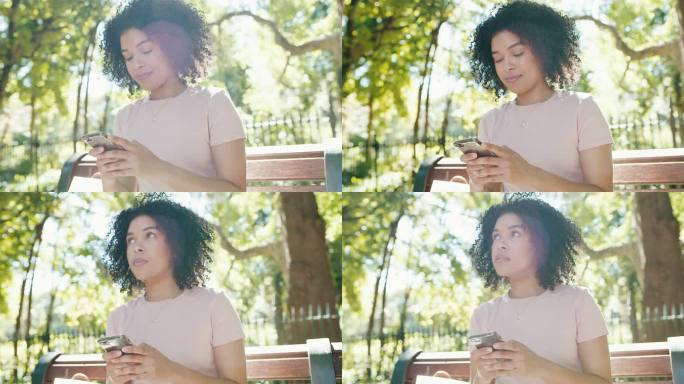 一名年轻女子在公园外使用手机听音乐的4k视频片段
