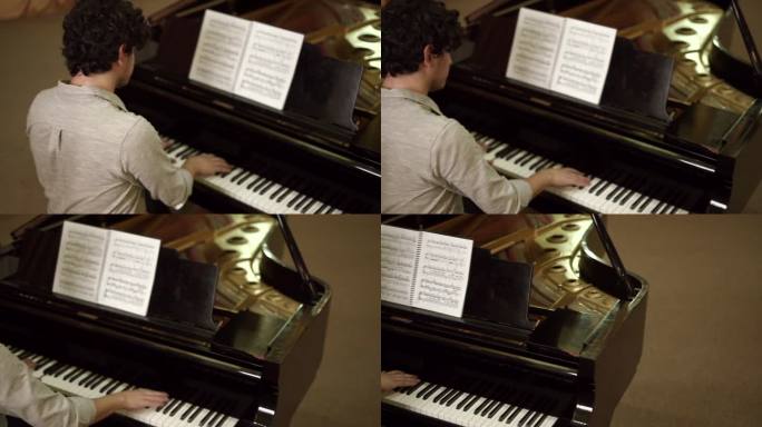 音乐系学生弹钢琴的后视图