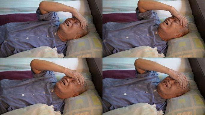4K患病的亚洲老人在家中感到头痛