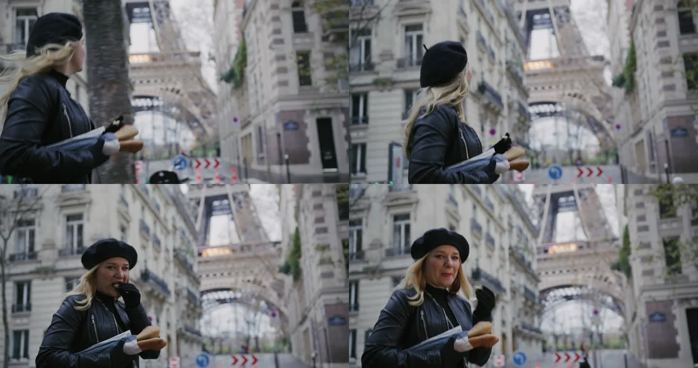 SLO MO时尚的法国女人在埃菲尔铁塔边的街上吃法棍面包