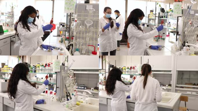 女化学家使用移液管精确地从实验室玻璃器皿中提取液体溶液。