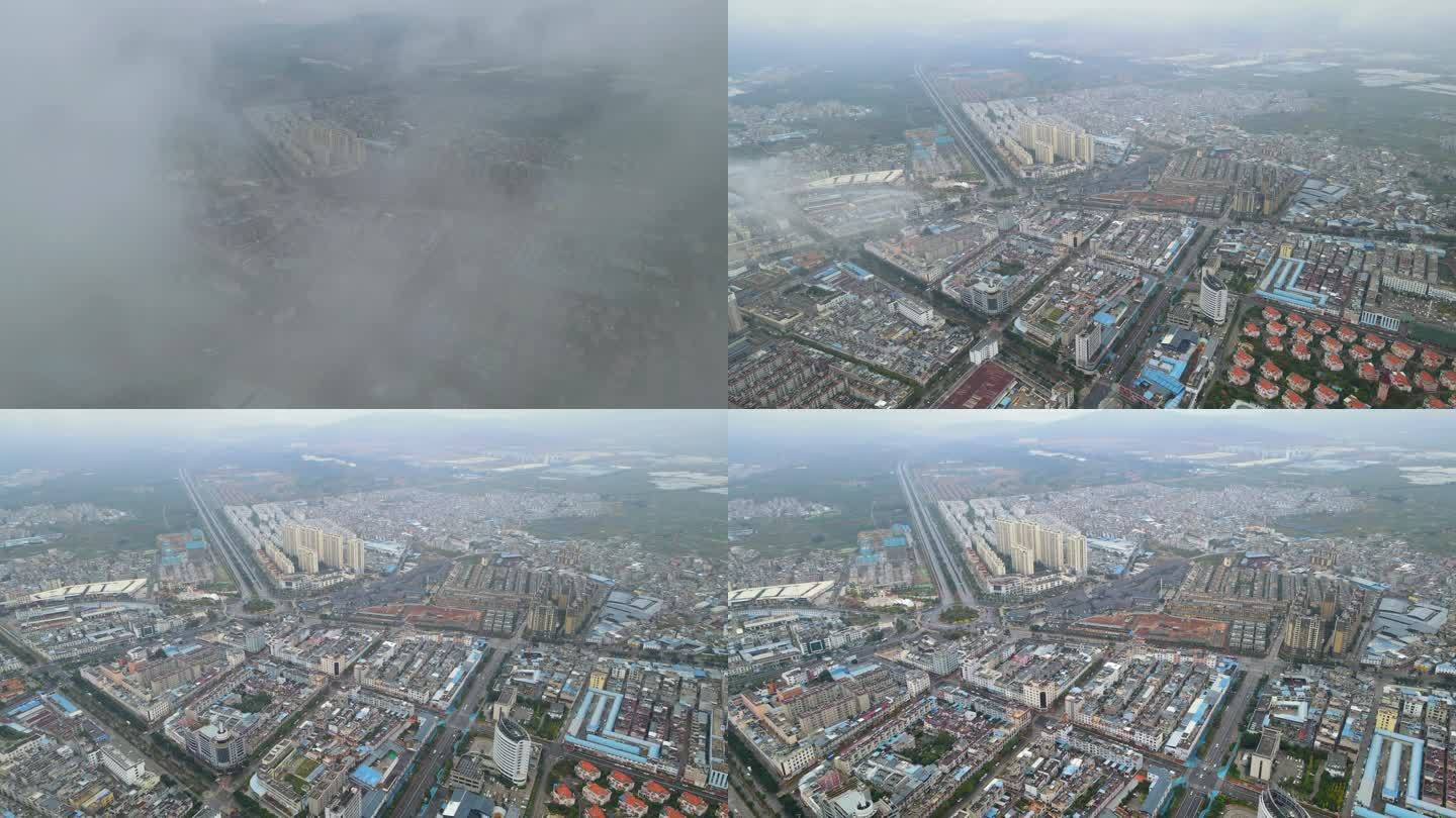 江川城区上空穿越云层看到大片建筑