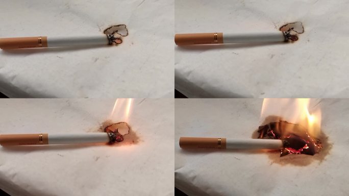 香烟在纸上燃烧 香烟引起火灾 香烟烟雾
