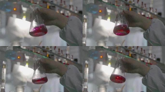 原素材-实验室摇晃红色液体量杯