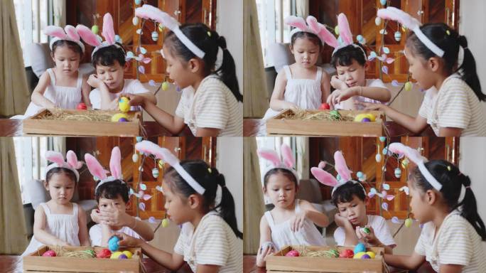 一群戴着兔子头带的亚洲孩子正在一起把画好的鸡蛋放进篮子里。孩子和朋友为复活节做准备和装饰。