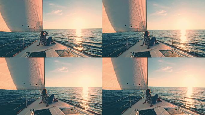 DS女子在帆船甲板上欣赏日落