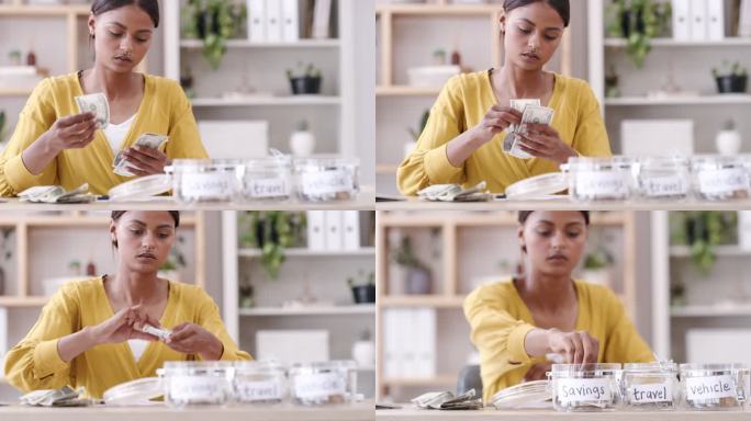 一个年轻女人在罐子里存钱。一个年轻的女人在为自己的钱做预算