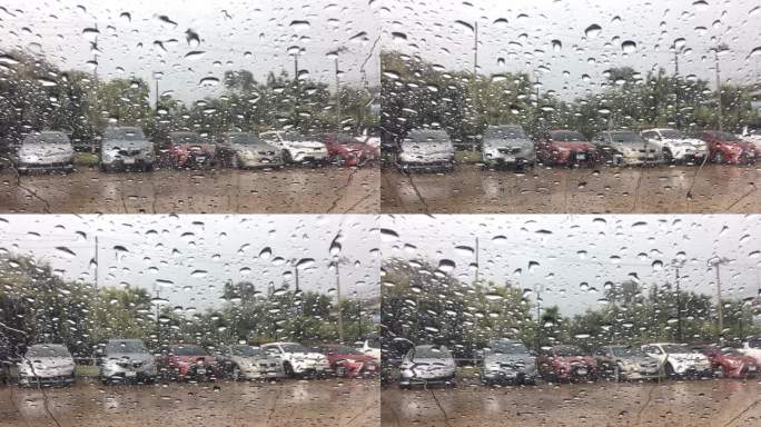水滴落在汽车玻璃上。雨滴泡滴落在汽车玻璃上。