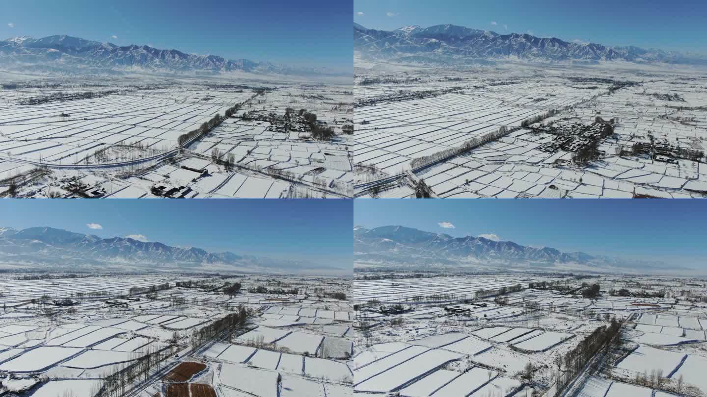 河西走廊祁连山下农村雪景