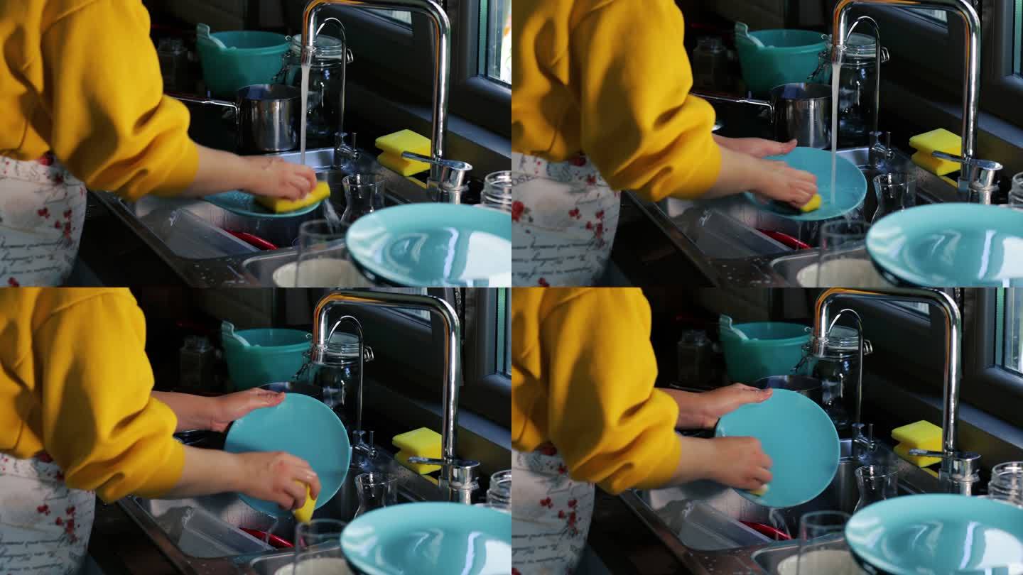 洗碗，打扫厨房，女人把盘子放进洗碗机