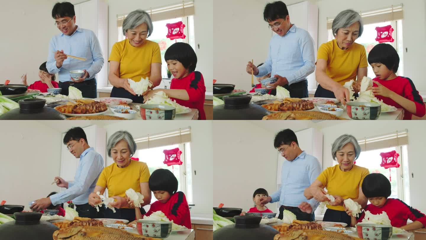 中国多代家庭在厨房准备新年食品