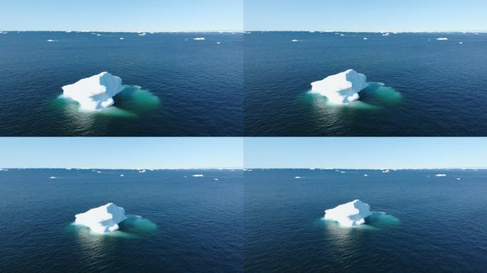 格陵兰岛阳光明媚的蓝色海洋表面上的冰山