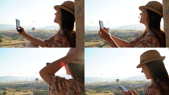 土耳其卡帕多西亚年轻女子使用智能手机