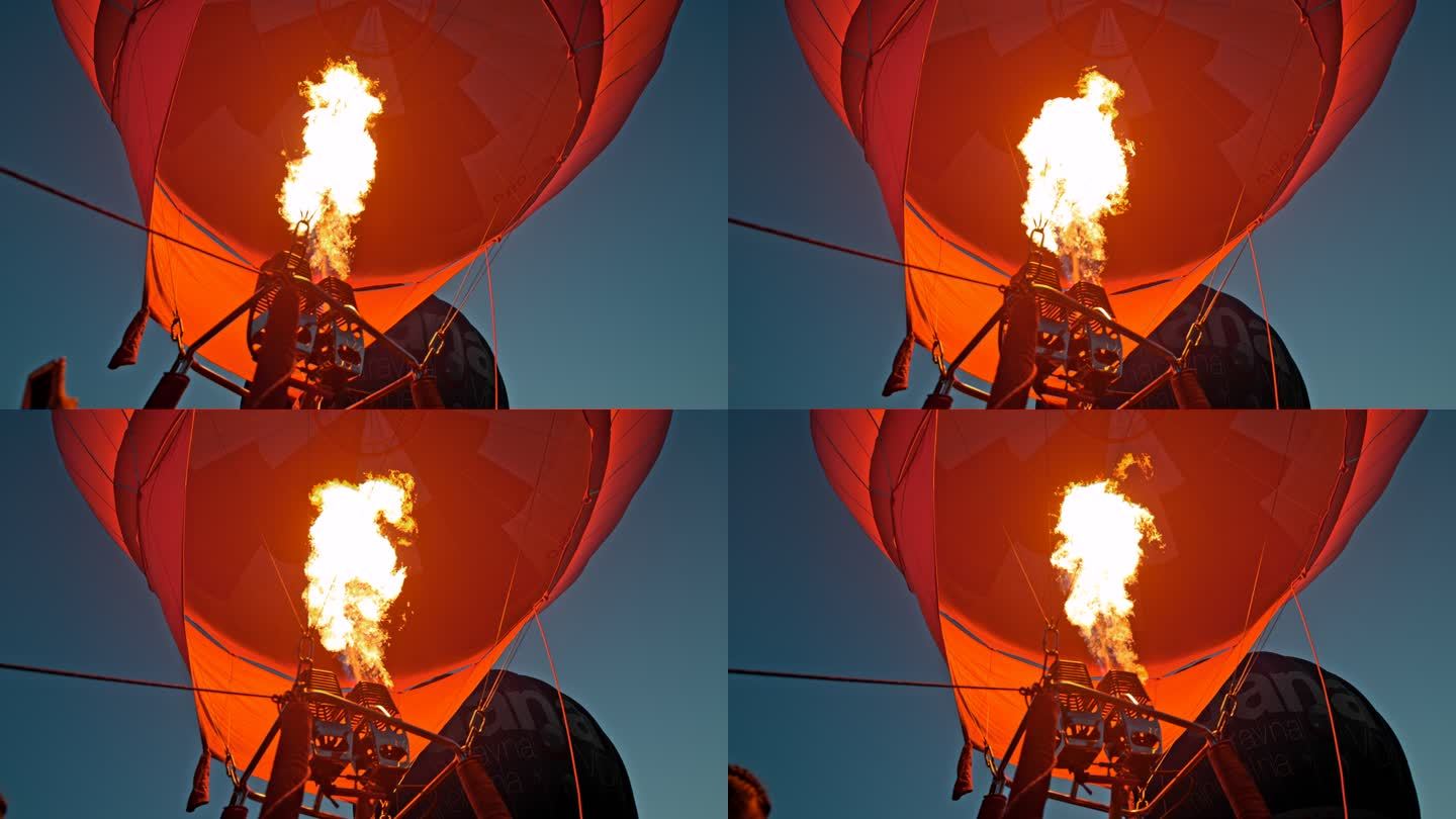 超级慢动作黄昏时火焰膨胀的热气球