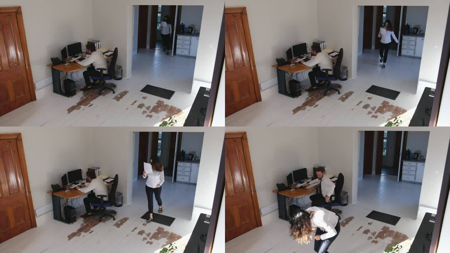 闭路电视镜头捕捉到一名女性在办公室摔倒