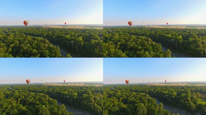 空中热气球在河流上空飞行