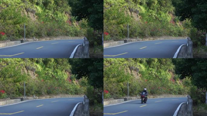 骑摩托车驶过弯道公路机车山路骑行道路过弯